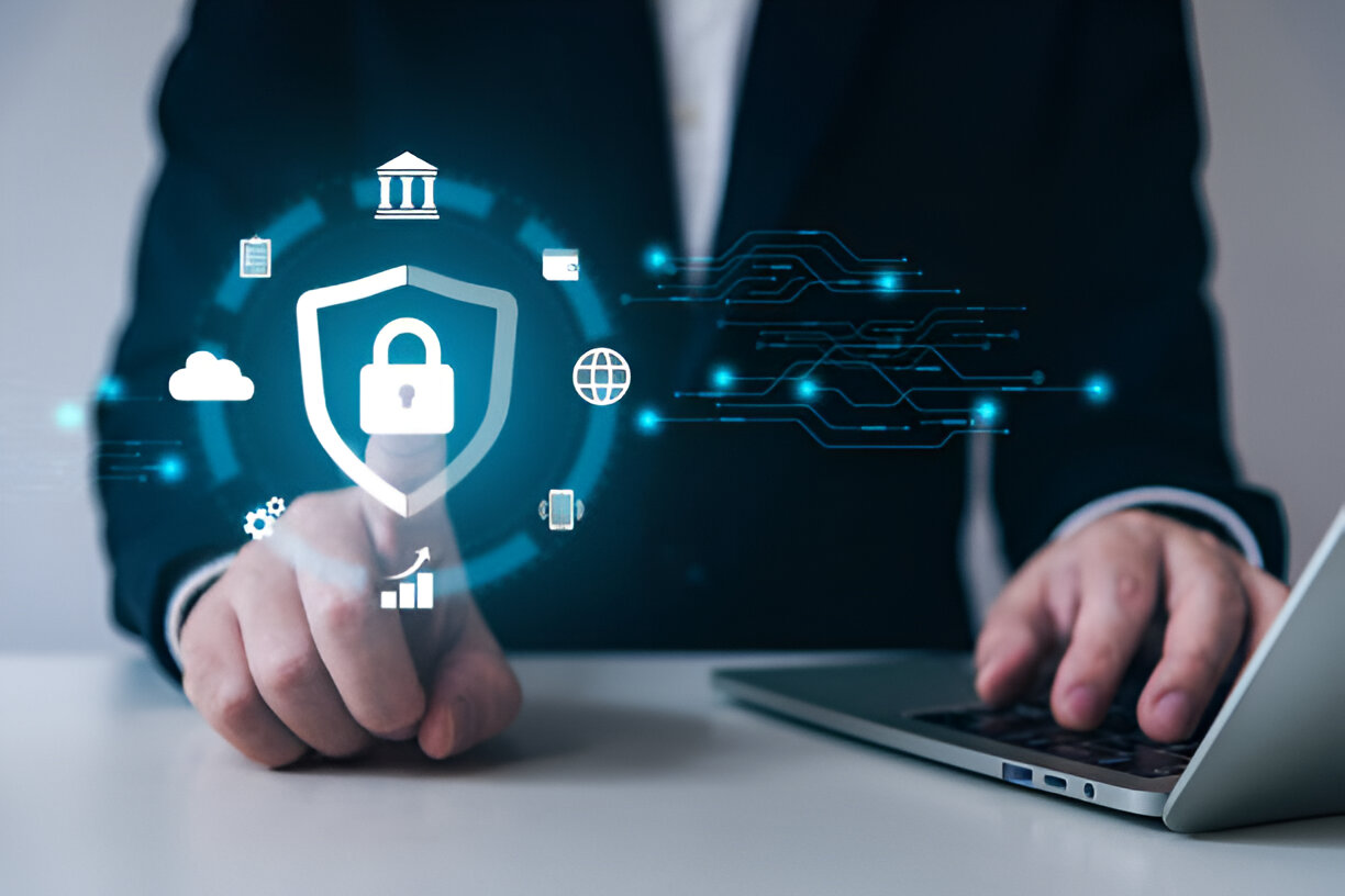 Business professional interacting with digital lock icon symbolizing cybersecurity protection and secure digital infrastructure.